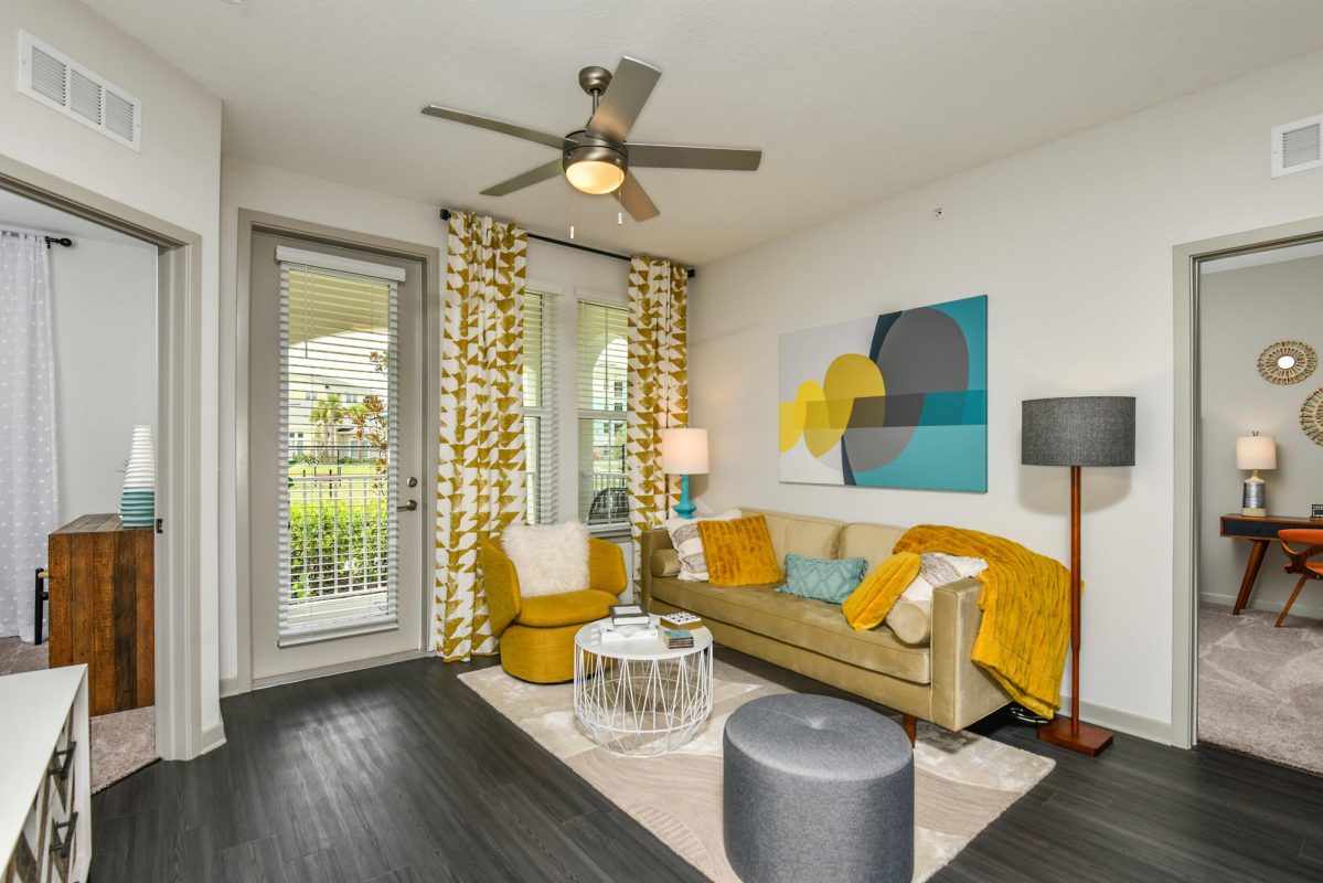 Living room with patio door and large windows