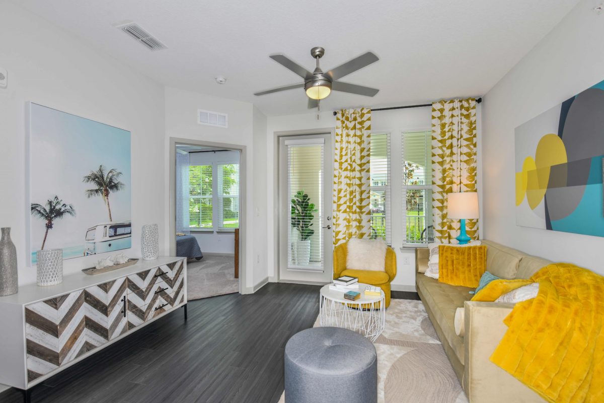 Living room with patio door and large windows
