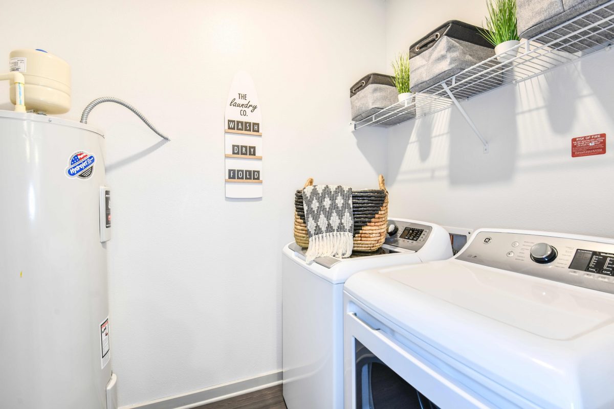 apartment laundry room with washer and dryer