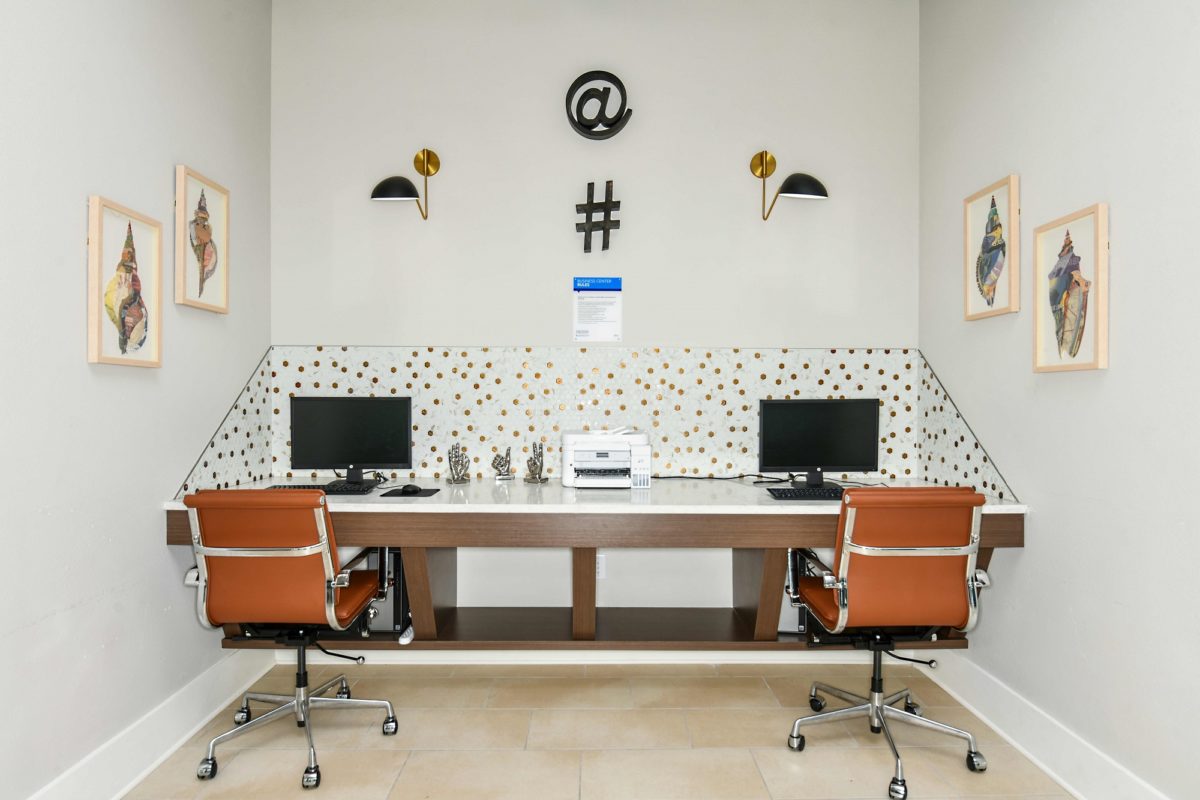 Business center with desktop computers and printer